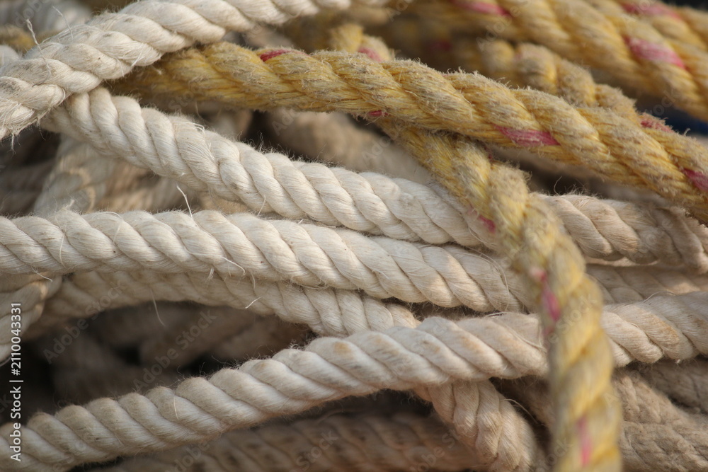 Fototapeta premium Macro close up shot of coiled textured marine rope details with nautical