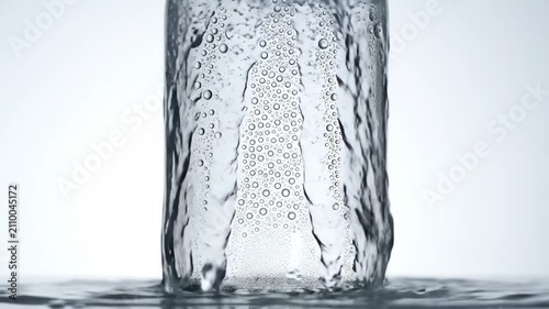 Refreshing Cold Drink Bottle with Bubbles and Condensation.