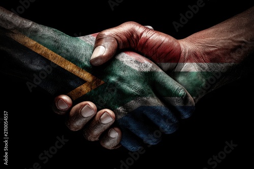 Hands shaking symbolizing south african unity