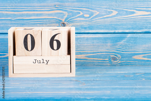July 6th. Date of 6 July on wooden cube calendar
