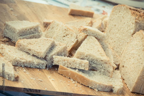 Pieces of fresh traditional wheat or rye bread on stall or in bakery