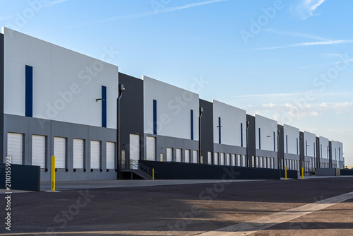 Картината върху платно New modern industrial warehouse buildings with loading docks and distribution fa