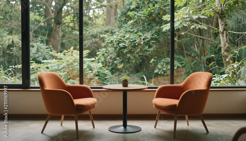 A cozy interior with two stylish orange chairs and a small round table, set against large glass windows showcasing a lush forest landscape, created using generative ai