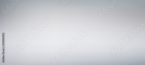 Empty bright light neutral grey minimalist modern studio presentation gradient background