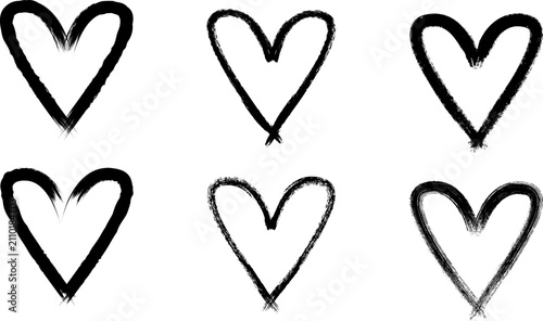 A collection of six hand drawn black ink heart shapes arranged in two rows as an isolated object on a transparent background isolated on transparent background