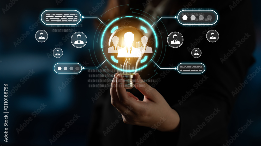 Fototapeta premium Business Professional Holding Futuristic Interface Displaying Digital Icons and Binary Code Concept of Technology, Networking, and Communication in a Corporate Environment. Sentient.