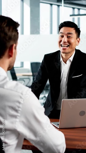 Two businessmen talking in office, professional collaboration meeting