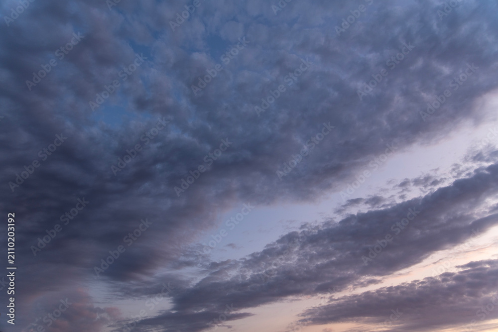 Fototapeta premium Beautiful summer sunset sky colorful clouds.