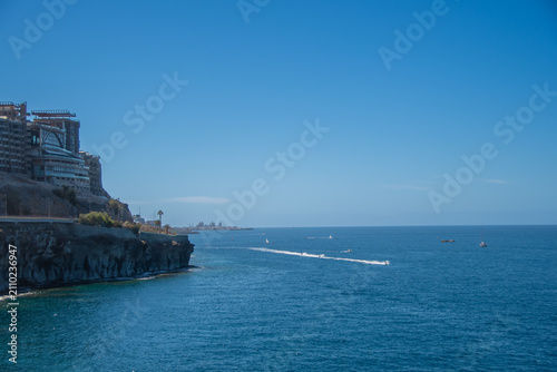 Coastal cliffs and resort hotel overlooking the Atlantic Ocean in Puerto Rico, Gran Canaria