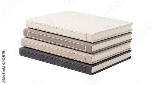 Minimalist linen notebook stack, collection of four neutral fabric journals, elegant stationery for sketching and writing on white background