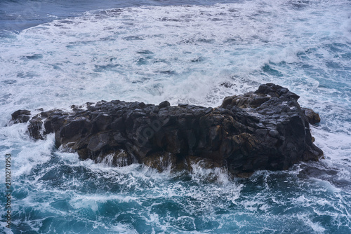 Obraz na plátně Volcanic rock in the churning Atlantic