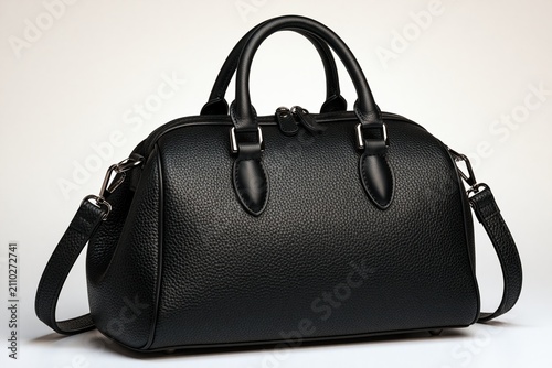 Stylish black leather-like bag with structured shape and metal accents