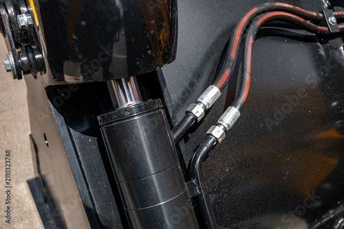 Obraz na plátně Skid steer loader attachment tilt hydraulic cylinder component