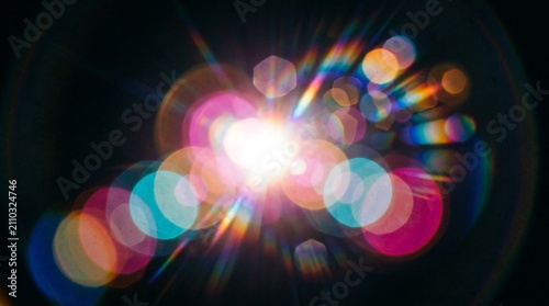 Vibrant Prism Lens Flare Light Leaks with Rainbow Bokeh Circles on Dark Background - Abstract Optical Overlay, Chromatic Light Burst, Glowing Orbs and Radiant Sunburst Effect for Creative Design