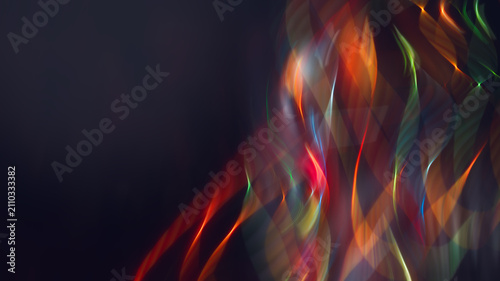 Abstract futuristic neon light trails on dark background with copy space.