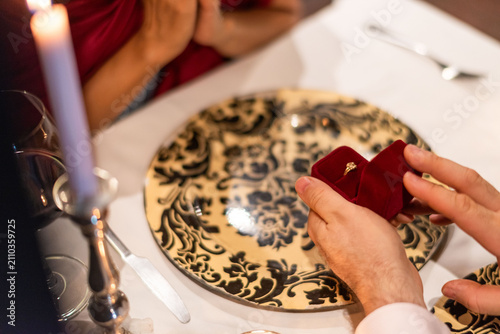 Fotografie Romantic proposal during elegant dinner