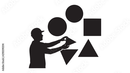 Silhouette of construction worker handling geometric shapes for design, training, and creative industry concepts