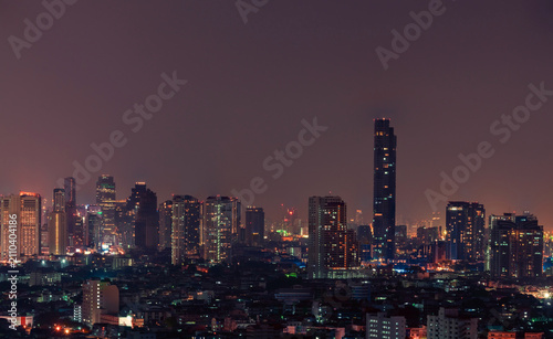 Cityscape of modern building in the night. Modern architecture office building. Skyscraper with beautiful evening sky. Business and financial center building. Apartment in the city with night light.