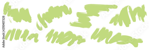Foto Light green brush strokes and painterly marks isolated on black background