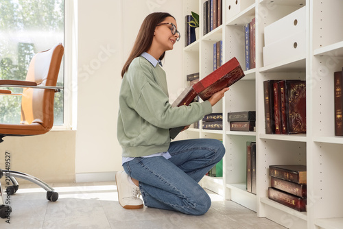 Young woman in glasses knee...
