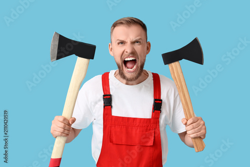 Angry man in red overalls h...