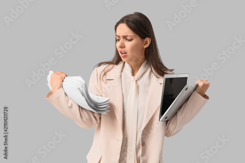 Overwhelmed young businessw...