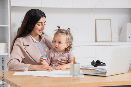 Young mother working from h...