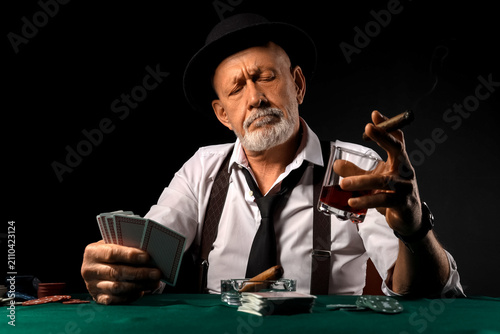 Stylish old man with cigar,...