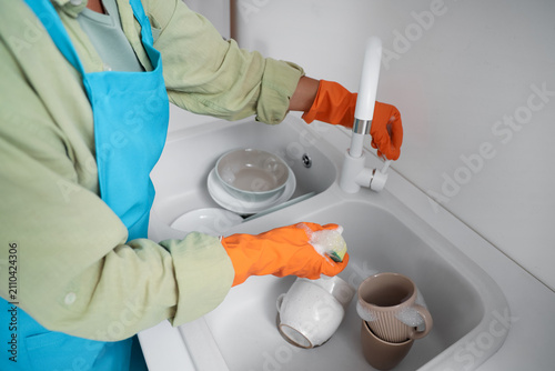 Woman with sponge washing d...