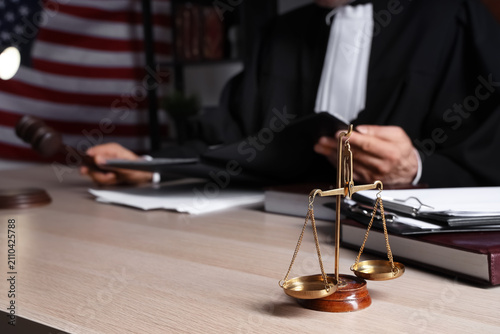 Justice scales on table of ...