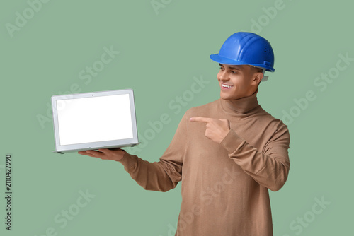 Young male engineer pointin...
