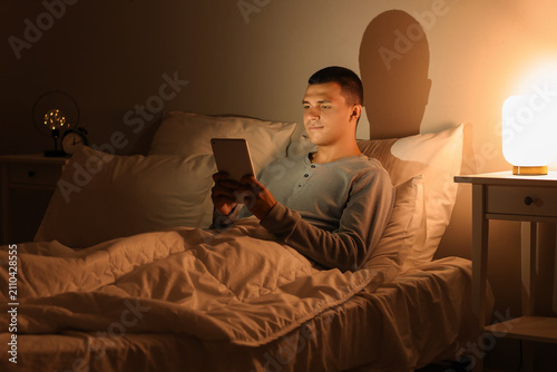 Young man using mobile phon...
