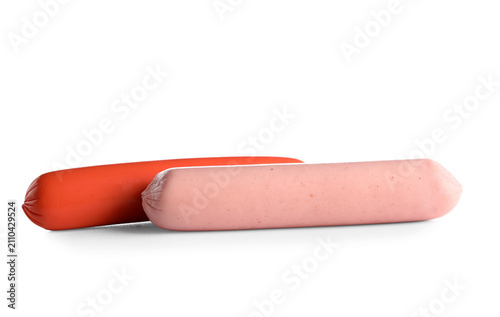 Tasty thin sausages on whit...