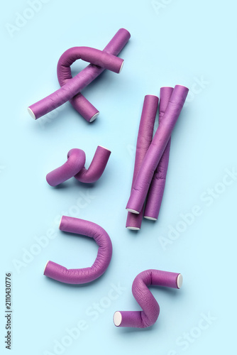 Hair curlers on blue backgr...