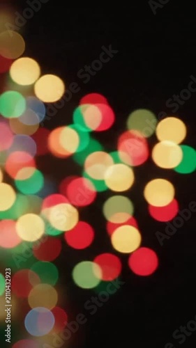 Abstract colorful festive lights glowing against a dark background