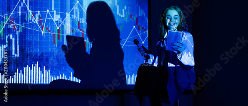 Smiling young woman holding...