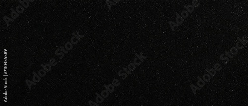 Solid black background with subtle grain texture