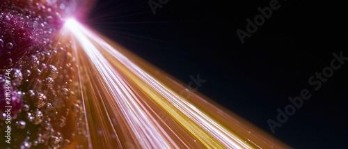 Abstract burst of luminous brine bubbles and glowing light streaks in magenta and orange over dark empty copy space for food branding and menus
