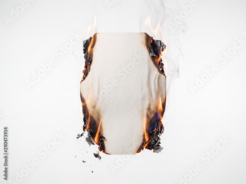 Canvastavla Burning blank white sheet of paper with open fire and smoke on white background