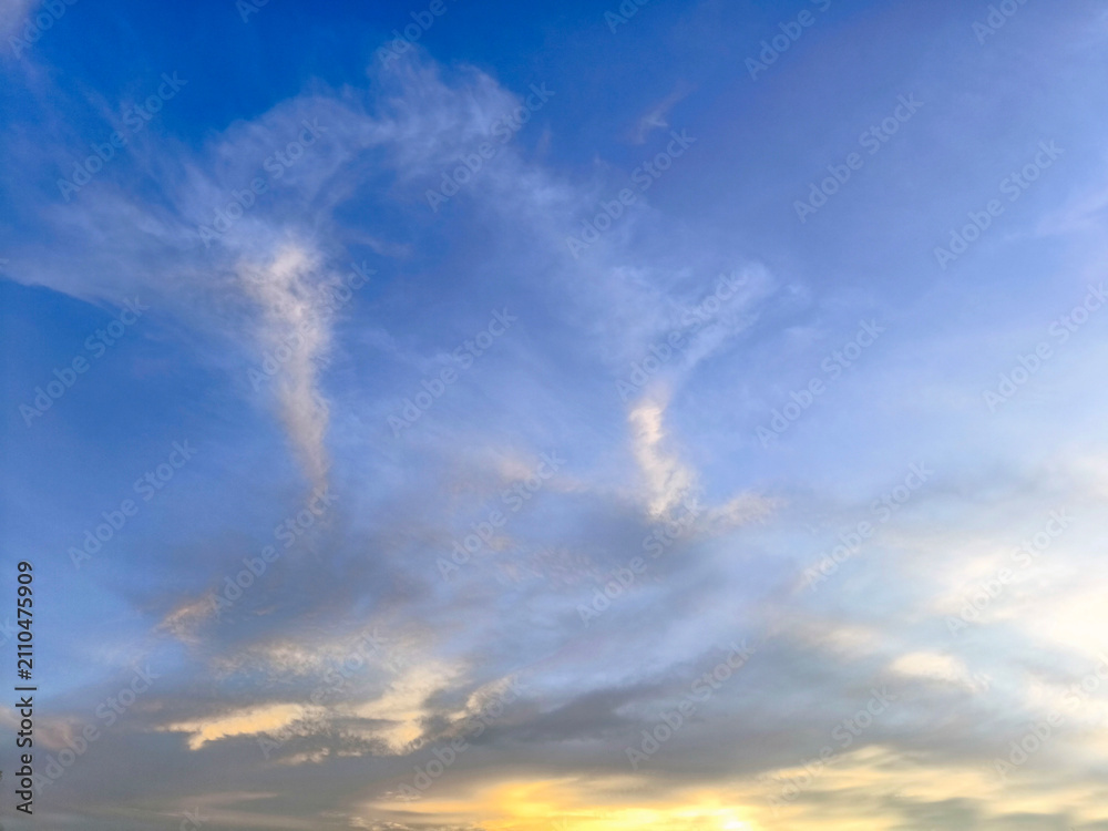 Fototapeta premium Colorful sunrise or sunset sky with clouds and warm light.