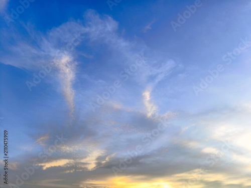 Colorful sunrise or sunset sky with  clouds and warm light.