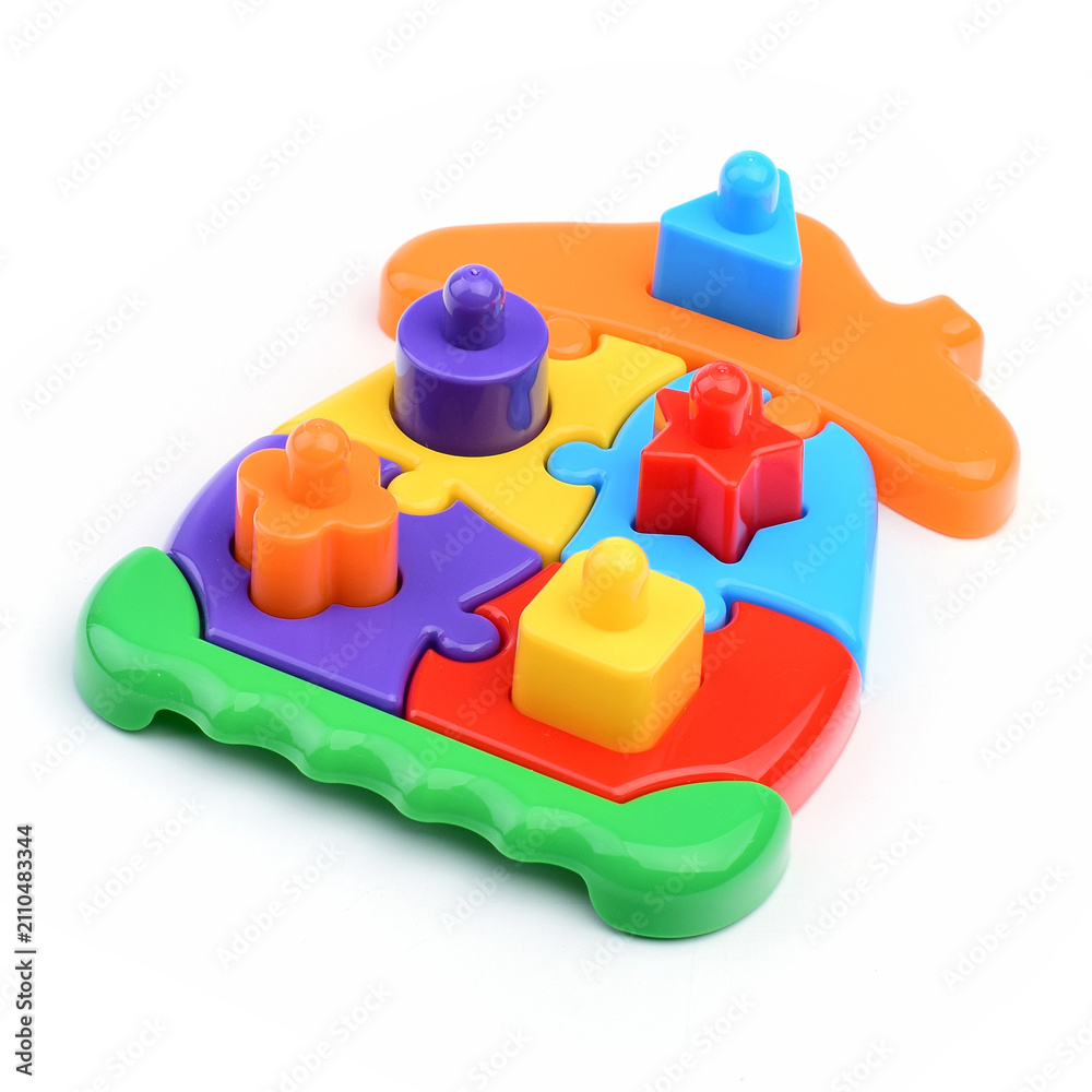 Fototapeta premium Plastic color construction kit for children's games isolated on a white background.
