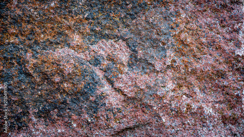 Obraz na plátne Detailed macro texture of a rough, weathered granite rock surface