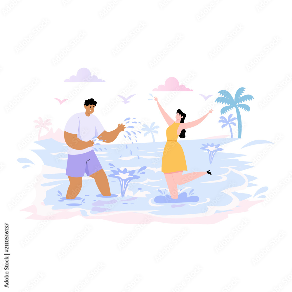 Fototapeta premium Couple splashing water at the beach.