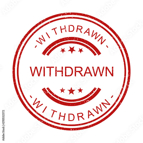 Фотография Red round rubber stamp with the word withdrawn and star symbols for documents is