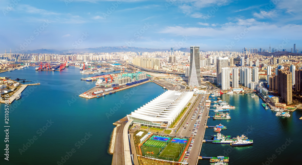 Obraz premium Aerial View of Modern Coastal City Port and Urban Skyline