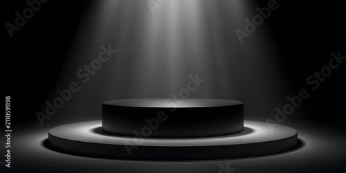 A dark stage with a spotlight illuminating a circular platform.