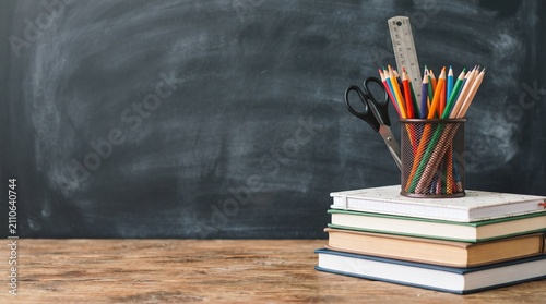 School and office supplies on classroom table
