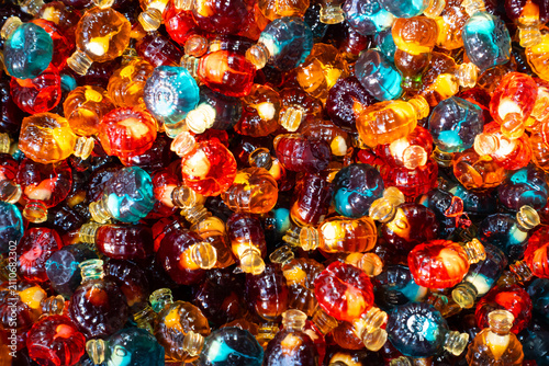 Colorful jelly cola bottle candies background texture