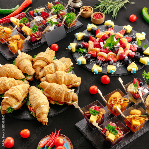 Fotografija Variety of catered appetizers and mini sandwiches